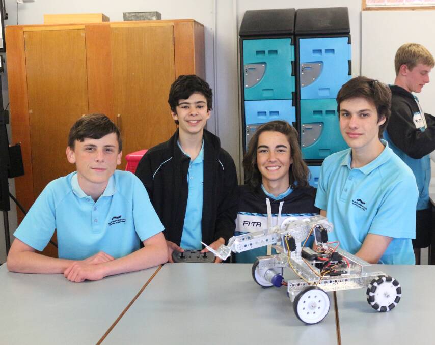 ENGINEERS: Kyle Jefferson, Aidan Peruzzi, Zac Demamiel and Marcel Zuccato with the robot they built as part of the ISTEM elective. PHOTO: Shaun Paterson