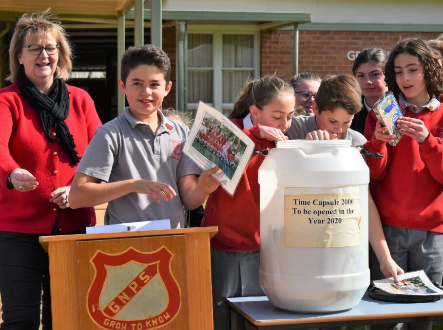 EDUCATION WEEK: Students from Griffith North Public School opening a 20-year-old time capsule. PHOTO: Shaun Paterson