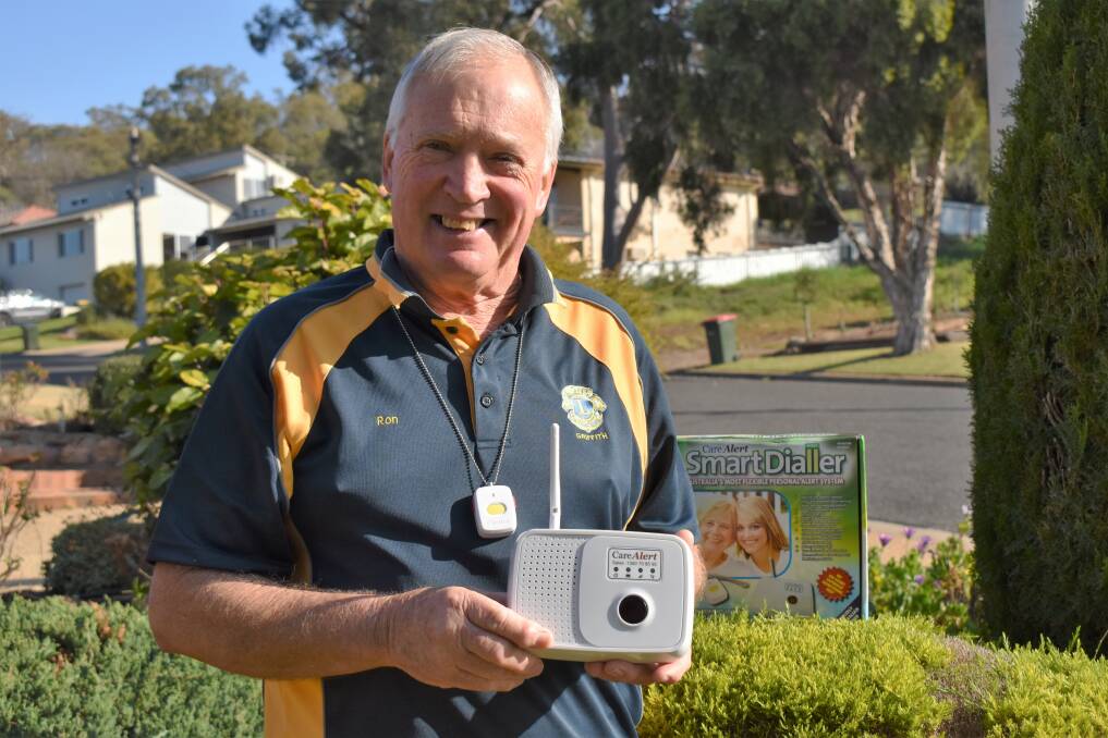 COMMUNITY CARER: Griffith Lion Ron Spencer with one of the many CareAlert units he has installed throughout Griffith. PHOTO: Shaun Paterson
