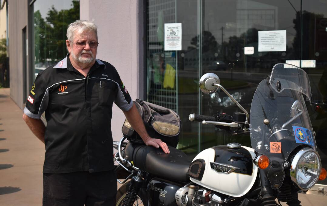 END OF AN ERA: Barry Day outside J&P Motorcycles with his personal bike. PHOTO: Shaun Paterson