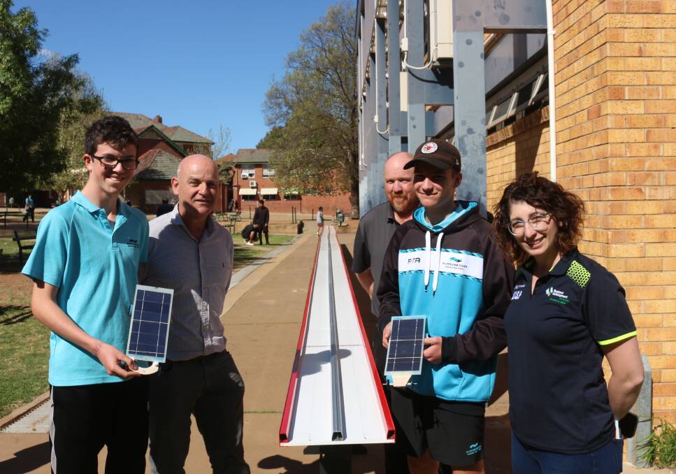 SUN SMART: Callum Weppler, Ian Preston, Brian O'Sullivan, Jamie Best and Cassandra Cadorin stand alongside the solar track. PHOTO: Shaun Paterson