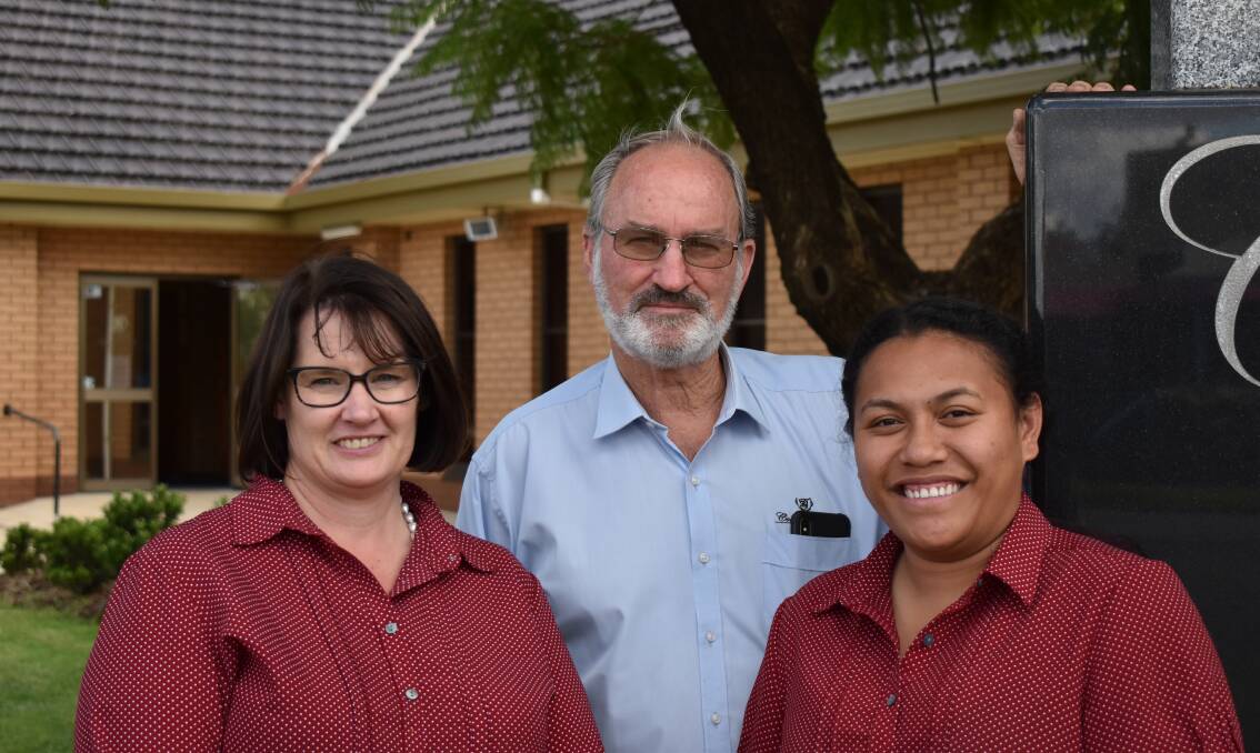 STANDING STRONG: Vanessa Barnes, Greg Collier and Lomey Tengere from Collier Trenerry Funeral Services. PHOTO: Shaun Paterson