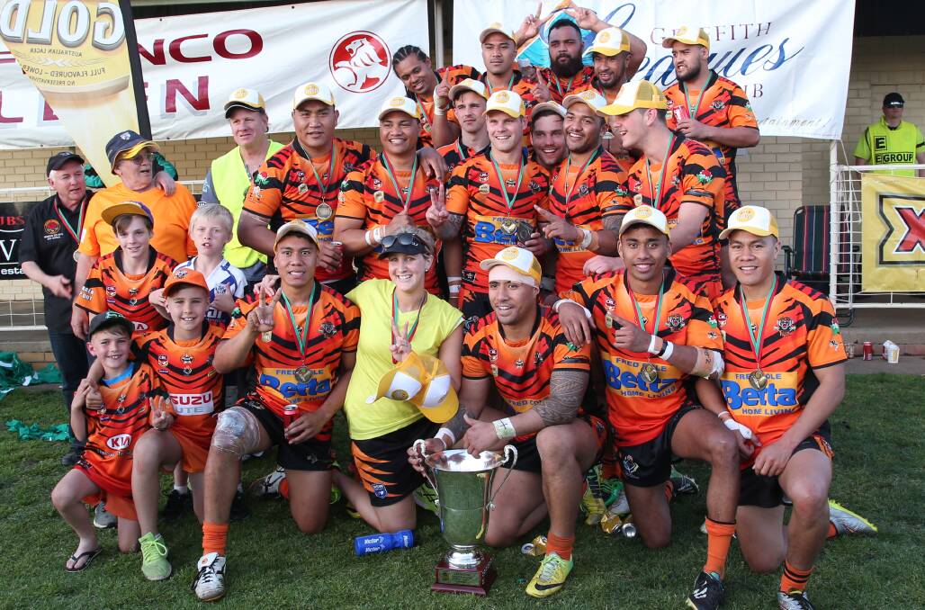 THE CHAMPS: Griffith Waratah Tigers are all smiles after securing back-to-back Group 20 titles. Picture: Anthony Stipo