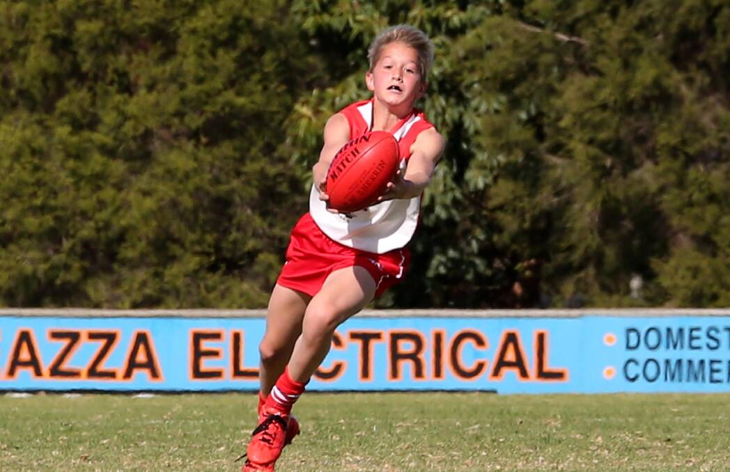 CATCH: Griffith Swans White under 13s player Luke Parmenter gathers the Sherrin. Picture: Anthony Stipo
