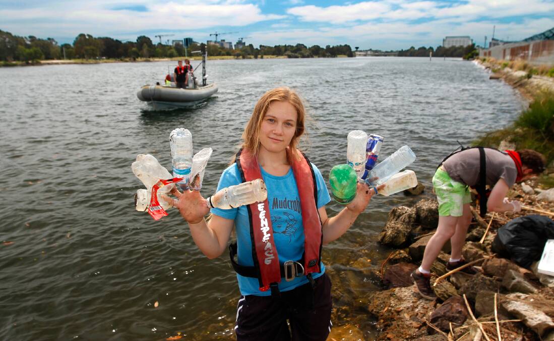 GARBAGE: Greenpeace volunteers collecting drink container rubbish from Sydney's Cooks River. Picture: Greenpeace/Jane Castle