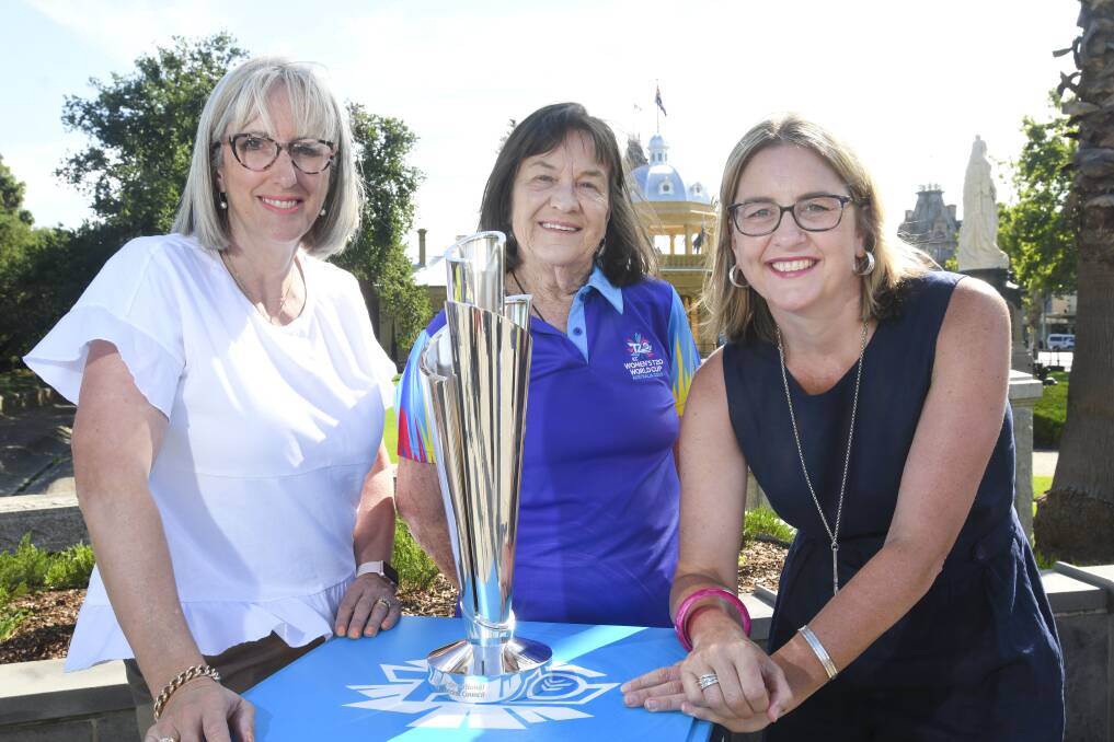 Mayor Margaret O'Rourke, T20 World Cup event volunteer Judith Kidman and Member for Bendigo East Jacinta Allan with the trophy at Rosalind Park. Picture: NONI HYETT