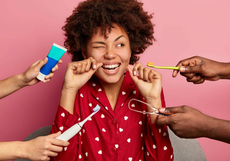 TIDY TONGUE: Studies show that using a tongue scraper twice daily can improve your sense of taste. Picture: Shutterstock. 
