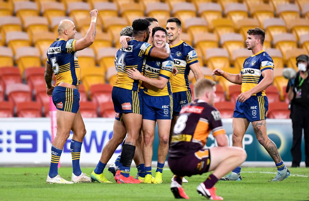 Parramatta players celebrate a try during the match against the Brisbane Broncos last week at Suncorp Stadium. The Eels were among the big winners from Round 3. Photo: Bradley Kanaris/Getty Images
