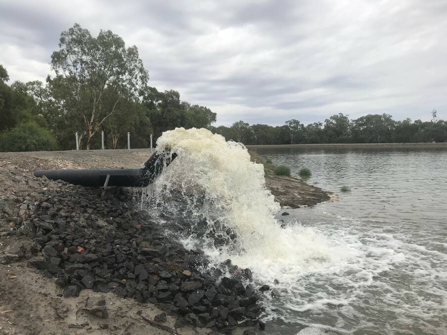 GUSHING: Lake Woorabinda had been bone dry for four years but 26 megalitres of water is now being pumped in each day until it is filled. Photo: Supplied.