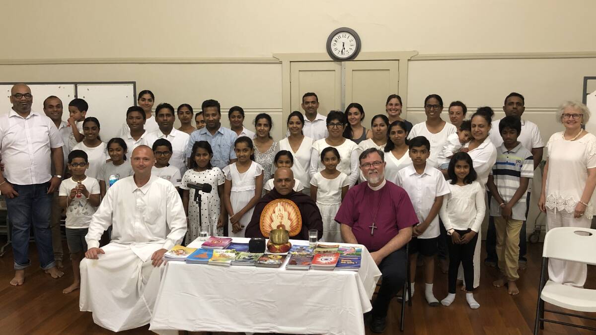 Griffith's Sri Lankan community with the Venerable Kovida (front left) and Bishop Donald Kirk (front right). Photo: Kat Vella.