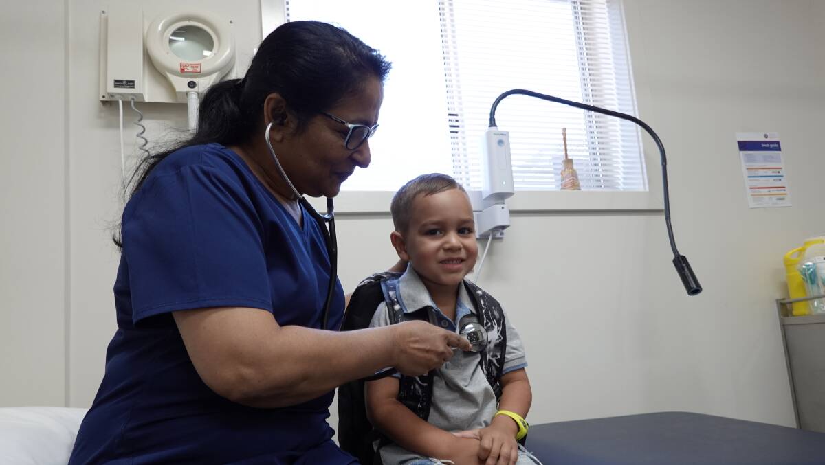 ALL IN ORDER: Dextan Williams gets his back to school health checkup from Dr Yalini Thevashangar at Griffith Aboriginal Medical Service. PHOTO: Monty Jacka