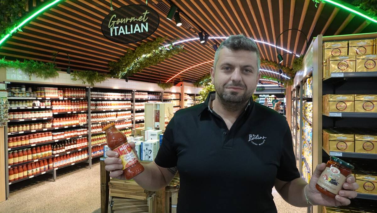 APERTO: The Italian Fresh Mercato store manager Luigi Dalessandro showing off some of the new supermarket's unique Italian products. PHOTO: Monty Jacka
