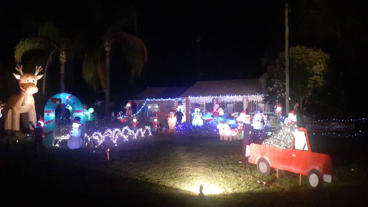 WONDERLAND: Jaye Armstrong's decorated home, complete with a five-metre-tall inflatable reindeer. PHOTO: Monty Jacka