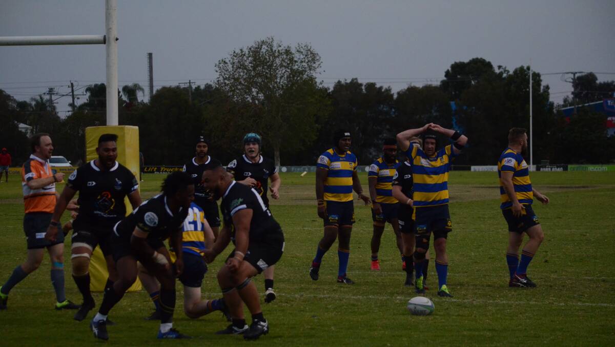 LAST-GASP: The Griffith Blacks celebrate a last-minute try from Nawi Rokocika to down the Albury Steamers. PHOTO: Monty Jacka