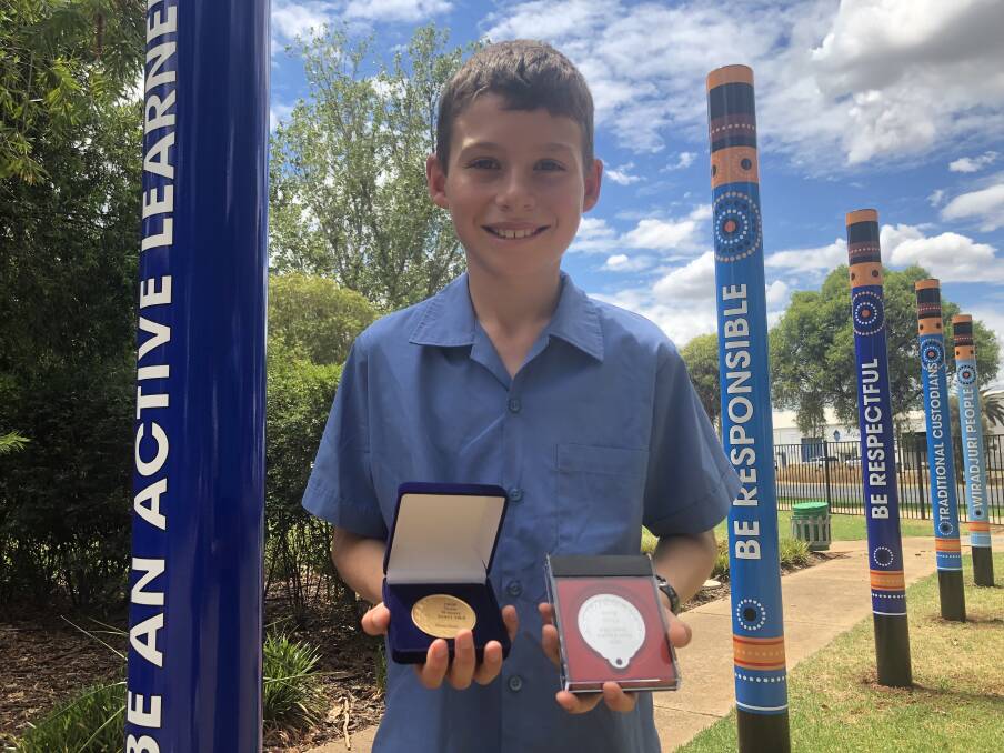 CHUFFED: Griffith East Public School year 4 student Flynn Bunn won a state public speaking medal for a speech about how the Olympic Games break down barriers. PHOTO: Monty Jacka