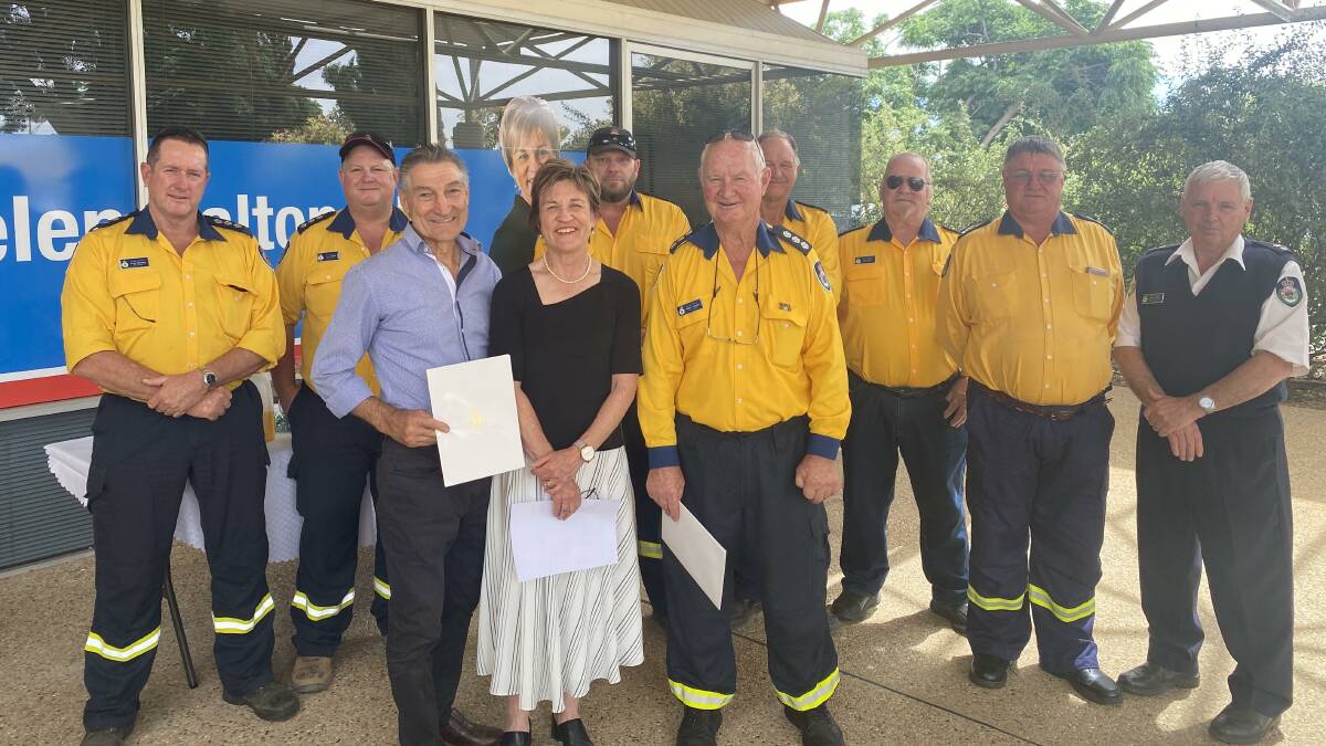 HEROES: Calabria Wines' Bill Calabria AM, Member for Murray Helen Dalton, and MIA RFS Group Captain Peter Lugsdin. alongside representatives from the NSW Rural Fire Service, MIA District. PHOTO: Supplied