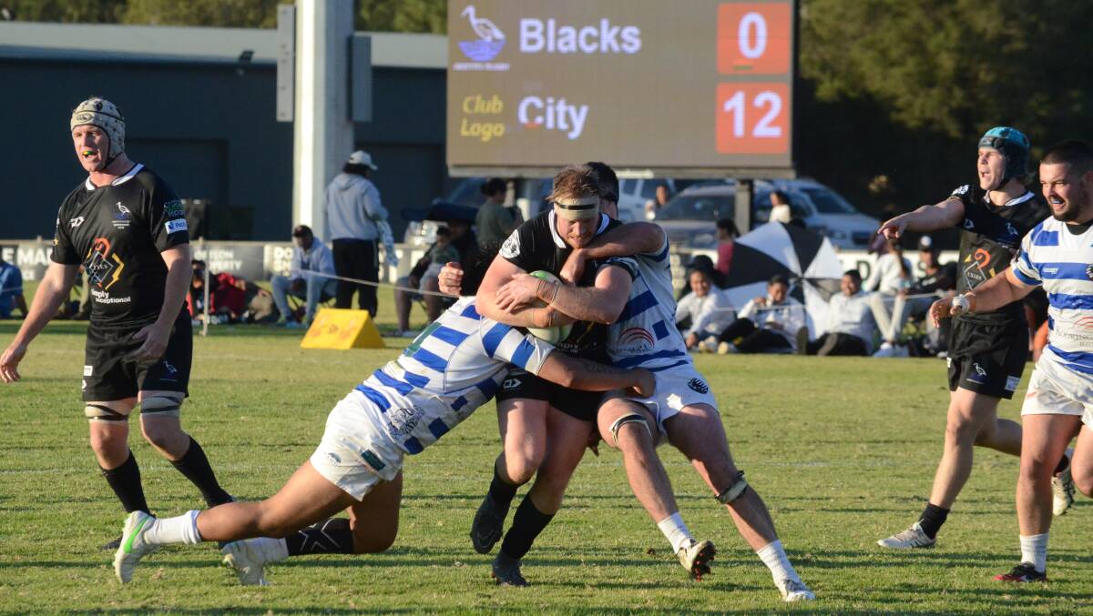 SURGE: Andries De Meyer pushes through two Wagga City players in the search for a comeback. PHOTO: Monty Jacka