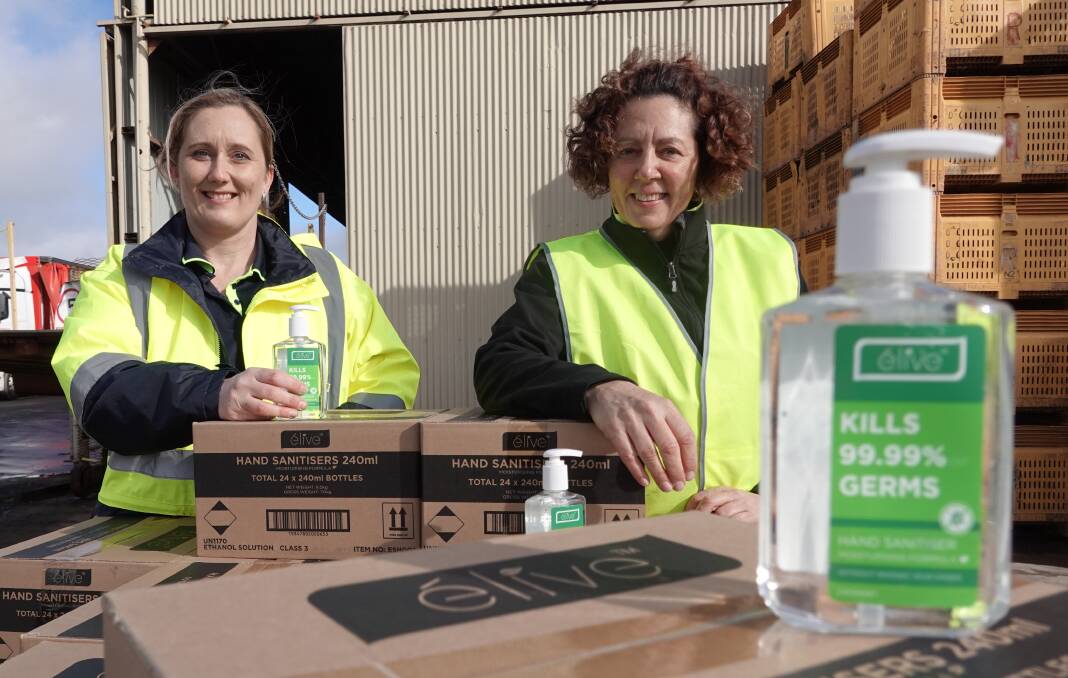 PROTECTION: Griffith Meals on Wheels' Tennille Valensisi and Kim Mecham with just some of the hand sanitisers set to be sent out across the community. PHOTO: Monty Jacka