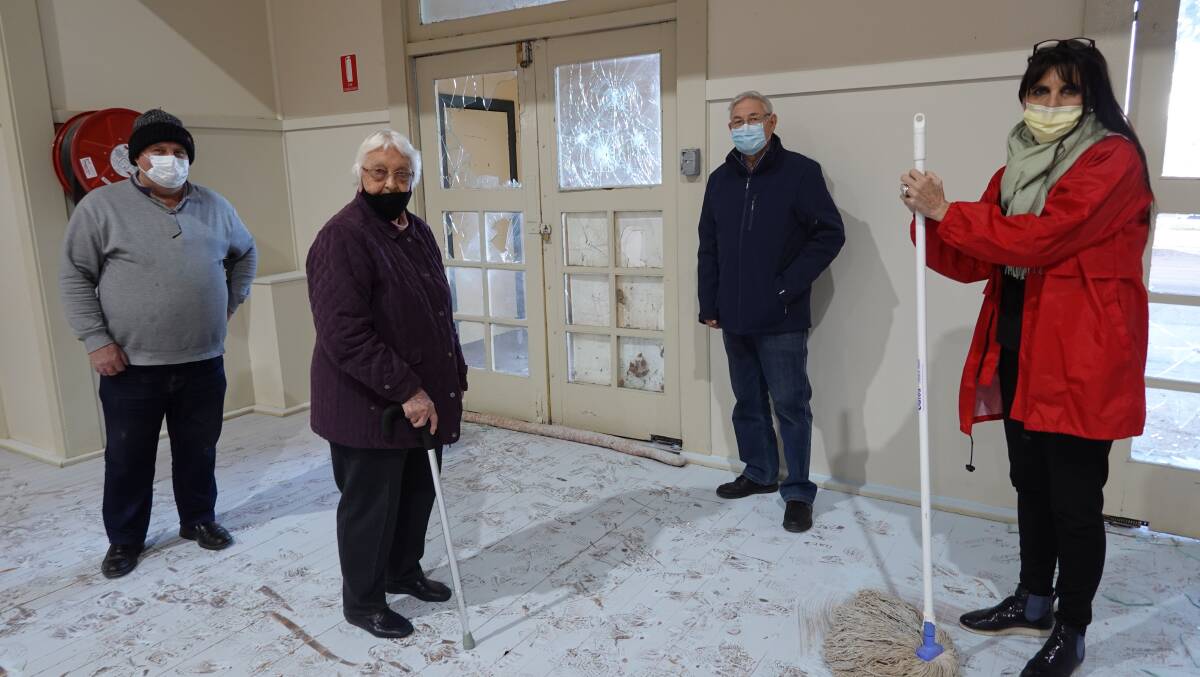 Greg Kench, Pat Spry, Brian Sainty and Christine Stead in the vandalised Woodside Hall. PHOTO: Monty Jacka
