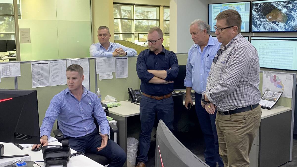 PREPPING: Murrumbidgee Irrigation staff with the Interim Inspector-General Troy Grant (right). PHOTO: Supplied