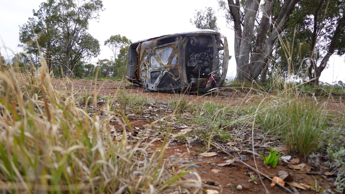 CHARRED: The remains of a burned out vehicle on Scenic Hill, extinguished by fire crews last weekend. PHOTO: Monty Jacka