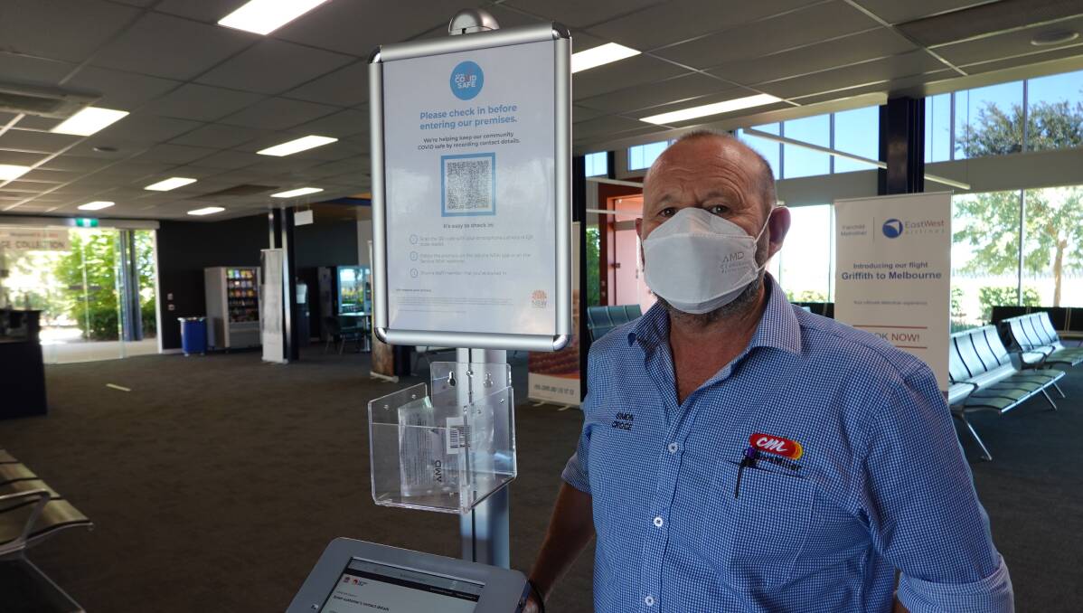 COVER UP: Deputy Mayor Simon Croce dons his mask while at Griffith Airport. PHOTO: Monty Jacka