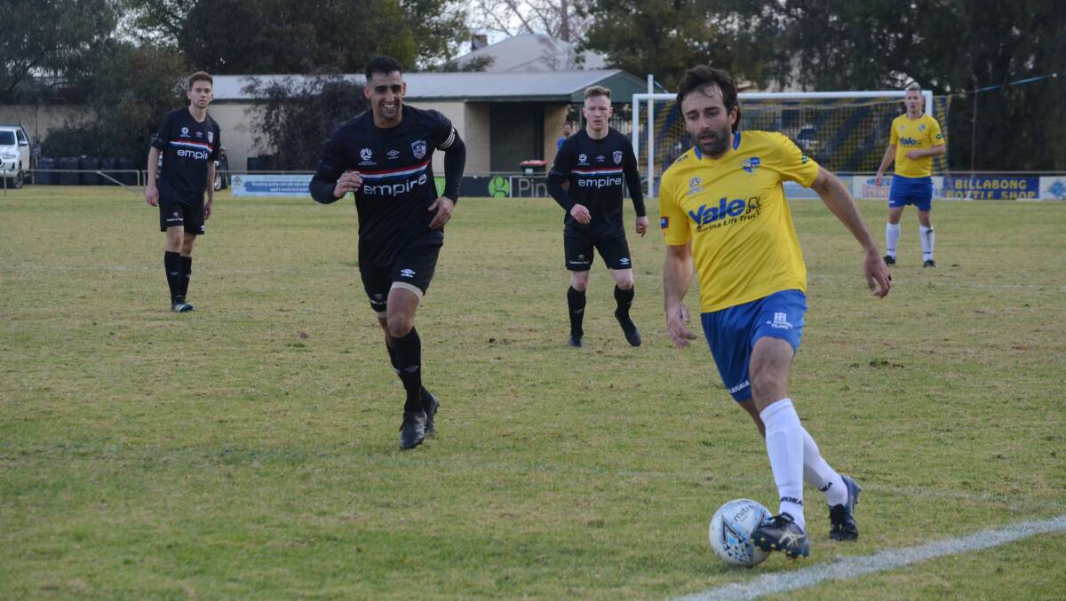 CHALLENGE: Andrew Vitucci keeps the ball in play against a solid O'Connor Knights side. PHOTO: Monty Jacka