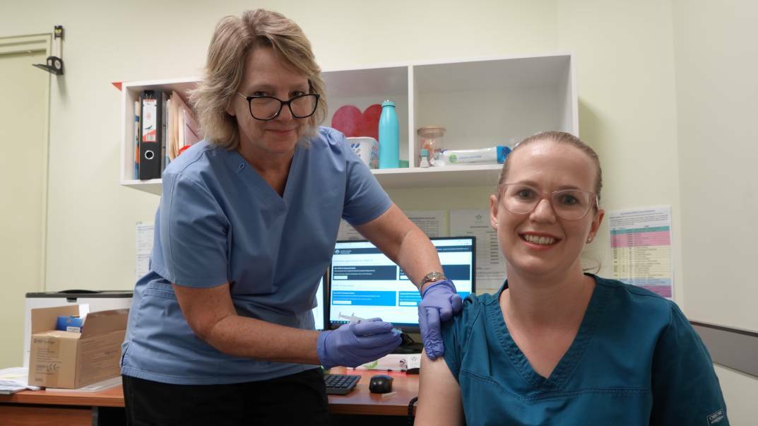 UNDERWAY: COVID-19 vaccination has already begun in Griffith. Your Health Griffith nurse Jacqui Mossman injects Sarah Jay. Photo: Monty Jacka.