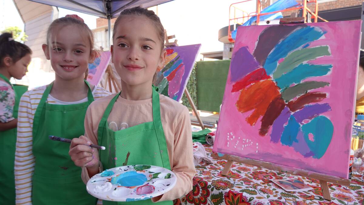 YOUNG TALENT: Twin sisters Scarlett and Pippa Townsend showcasing their creativity at the Youth Art Workshop. PHOTO: Monty Jacka