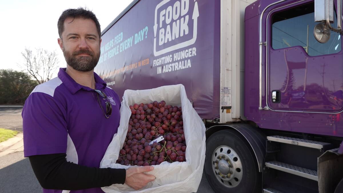 PRODUCE: Foodbank's Adam Loftus hoped that the 15 pallets of food would help alleviate some stress for Griffith residents doing it tough. PHOTO: Monty Jacka