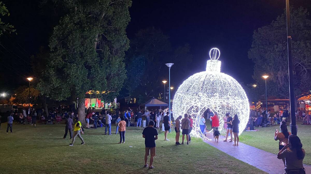 O HOLY NIGHT: Hundreds came down to Memorial Park on Saturday for the Carols by Candlelight event. PHOTO: Supplied
