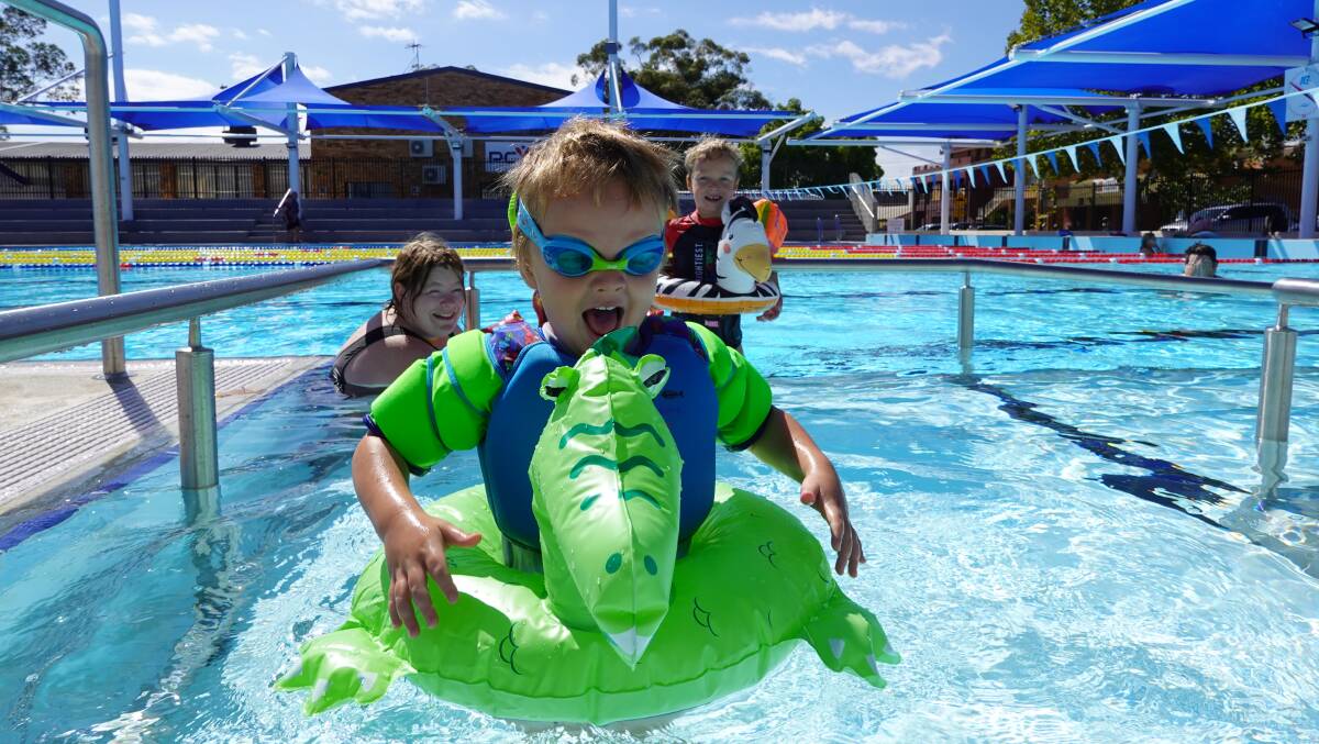 TESTING THE WATERS: Josh Eade-Smith and his inflatable dragon were having plenty of fun in the new pool. Picture: Monty Jacka.