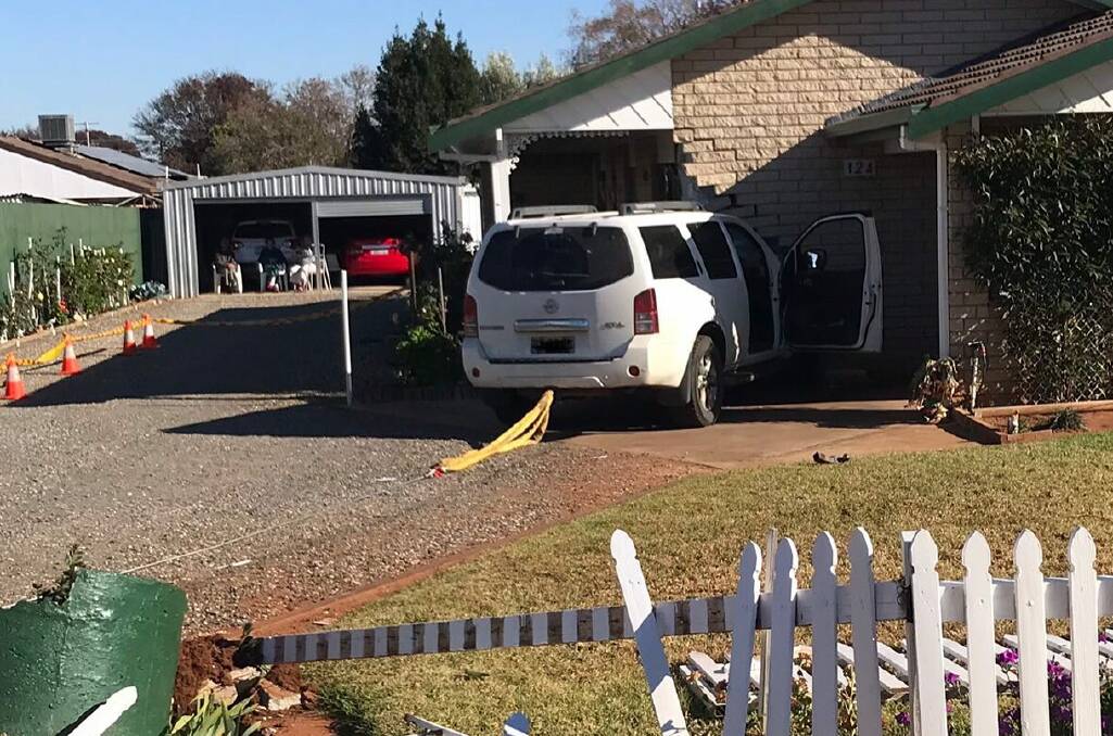 The car slammed through the Merrigal Street front yard and into the home at about 9am on Sunday. PHOTO: Fire and Rescue NSW Station 311 Griffith