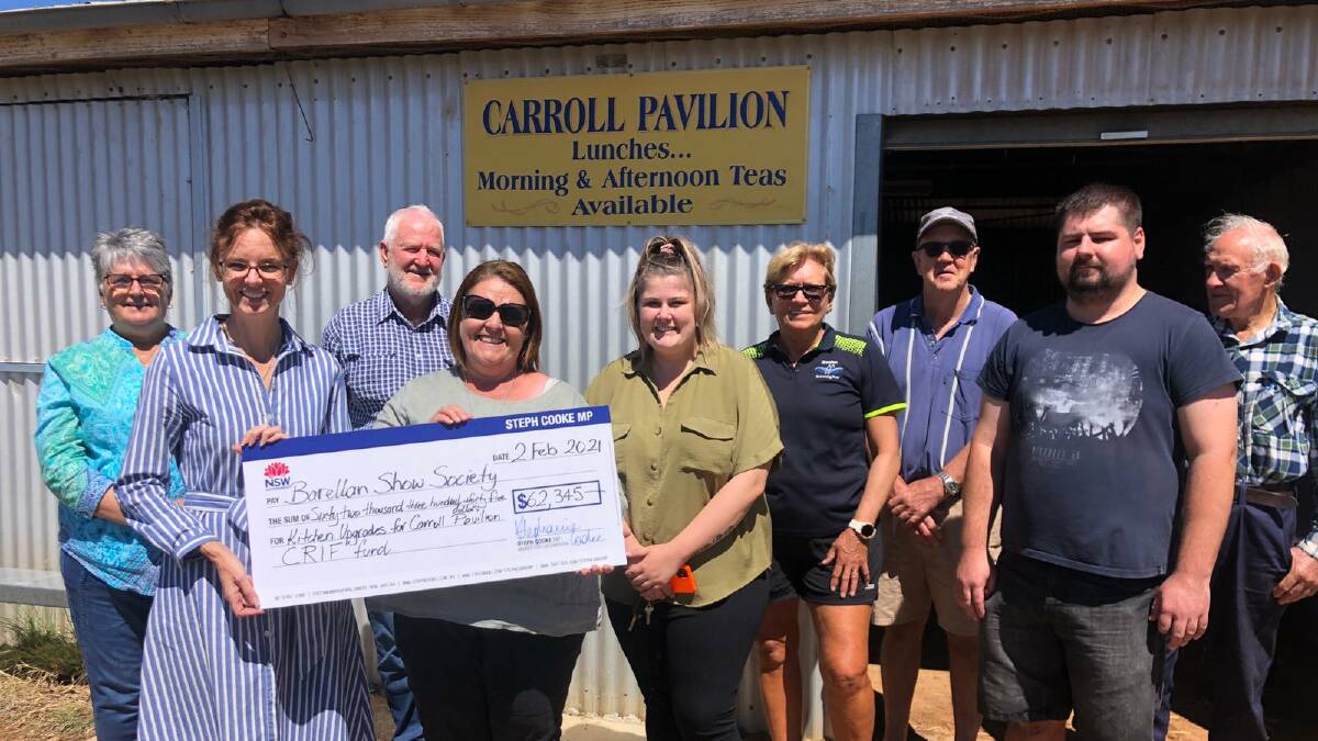 DELIGHTED: Member for Cootamundra Steph Cooke hands the Barellan Show Society their new grant. Photo: Supplied.
