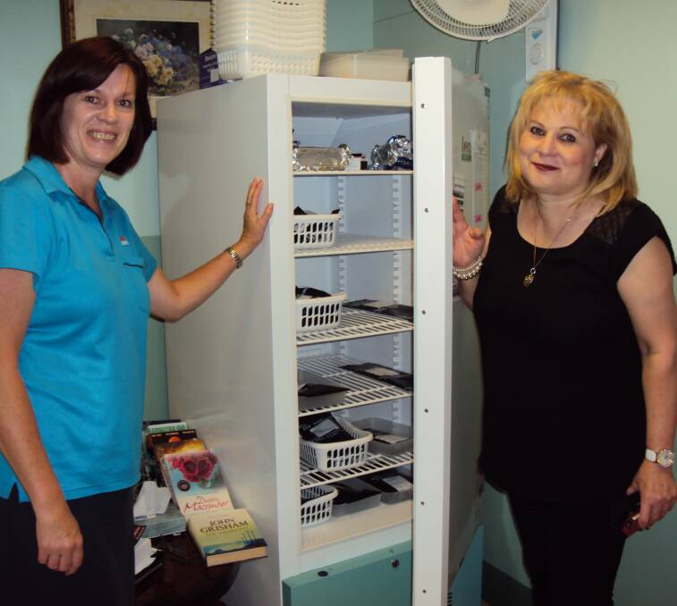 CHILL OUT: Margaret King (LHAC Chair) and Yvonne Turnell (LHAC member) with the temperature controlled fridge in the newly refurbished Oncology clinic.