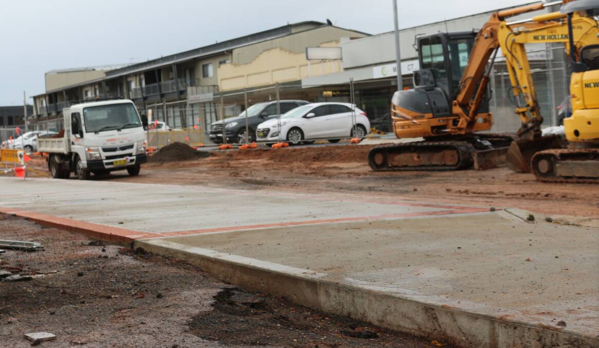SETBACK: Workers on the Yambil Street development were forced to fix concrete at the McCook car park entry after vandals etched names into the drying concrete. PHOTO: Calhan Behrendt