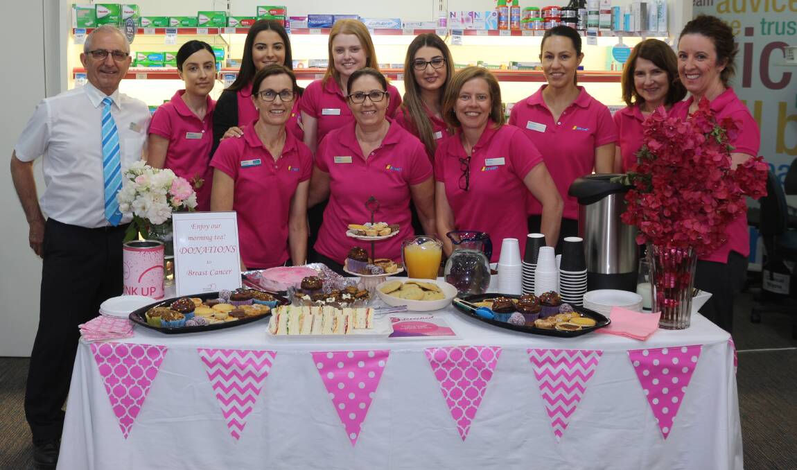 PINK POWER: The team from Pat Zirilli Amcal Chemist show off a rich morning tea as part of a stall which aims to raise awareness of early breast cancer detection. PHOTO: Calhan Behrendt
