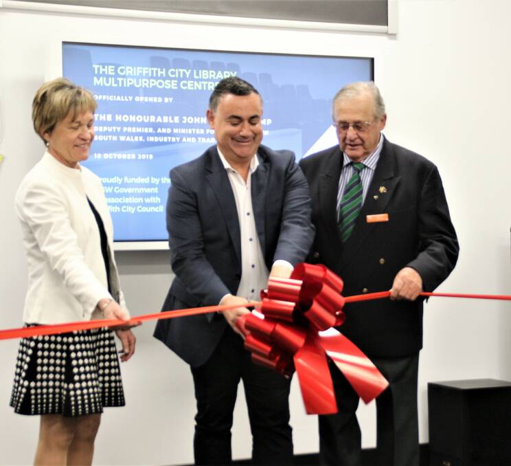 OPEN FOR USE: Member for Murray Helen Dalton, Deputy Premier John Barilaro and Griffith mayor John Dal Broi open up the new multipurpose room at the Griffith City LIbrary. PHOTO: Calhan Behrendt