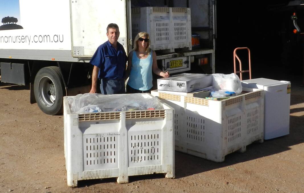 LOADING UP: Kevin and Debbie Torresan prepare to load up goods as part of their annual donation drive for the Ronald McDonald House in Randwick. PHOTO: Contributed