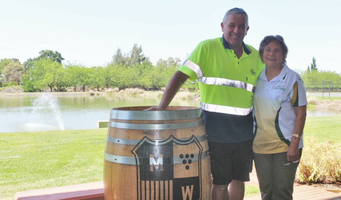 SHOWING SUPPORT: McWilliam's Wines worker Ivo Sartor and Griffith Can Assist president Olga Forner will be helping raise money to help support those living with cancer by donating the proceeds of hay bale sales from the winery. PHOTO: Calhan Behrendt