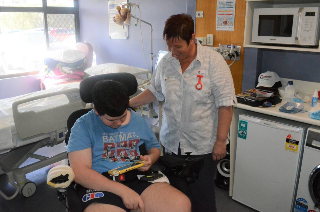MINING AWAY: Ned Stewart gives the new Nintendo Switch a spin, showing nursing unit manager Tracey Costin how to play Minecraft. PHOTO: Calhan Behrendt