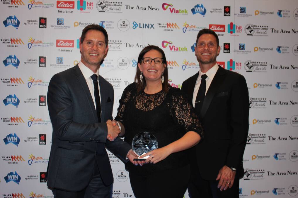 AWARD-WINNING: Sponsor BEC Business Advice's Jodie Ryan presenting the Outstanding Employer of Choice award to Owen Toyota's Dean and Mark Owen at the Griffith Business Chamber Awards night. PHOTO: Jacinta Dickins