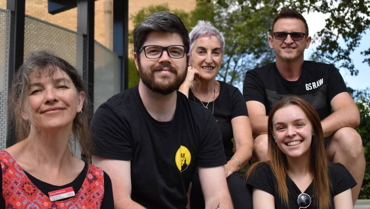 TIME TO LIGHT THE LIGHTS: Musicians Ben Ceccato (second from left), Anastasia Comarin (bottom row right) and Robert Fattore (top row right) plan for the Bushfire Benefit Concert on Friday in Memorial Park along with organisers Aanya Whitehead (left) and Raina Savage (middle). PHOTO: Shaun Paterson
