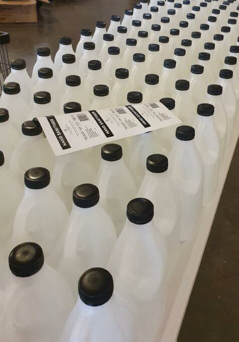ROWS OF SANITISER: More than 5,000 two litre bottles of liquid hand sanitiser has been produced by the winery to date. PHOTO: Supplied