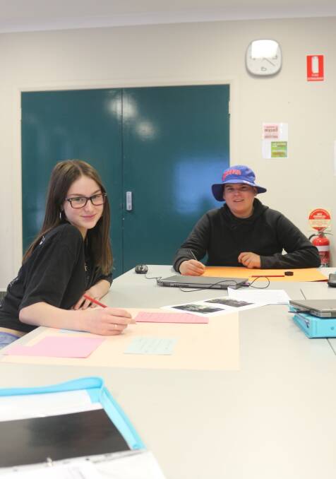 WORKING: Taya Scott and Jordan Carusi work on their project submissions. PHOTO: Calhan Behrendt