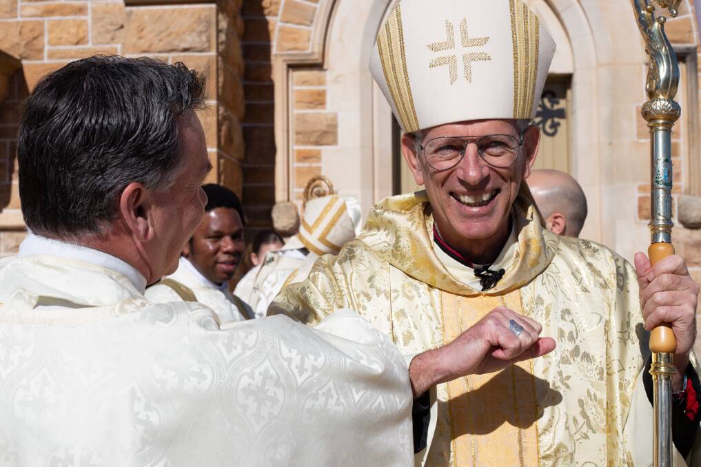 GREETING: Bishop Mark Edwards outside St Michael's Cathedral at his installation ceremony. PHOTO: Contributed
