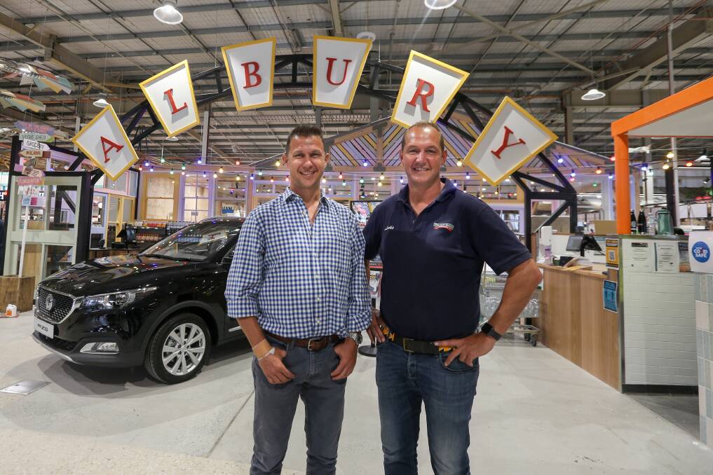 NEW STORE: Harris Farm Markets co-chief executives Tristan and Luke Harris welcome the Border community to their new store. Brother Angus was back at home with his family on Thursday. Picture: TARA TREWHELLA