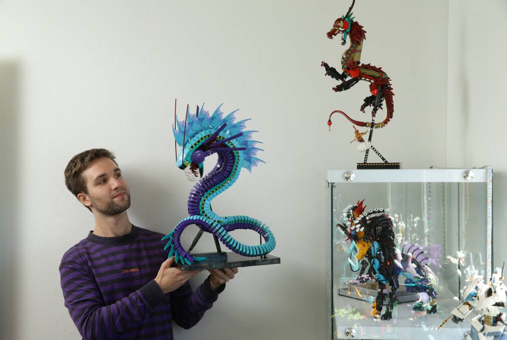 CREATIVE: Joss Woodyard with his creation, Dagon, which is scheduled to be exhibited at LEGO House in Denmark, along with other brick builds he has designed and are on display in his study. Pictures: Jonathan Carroll