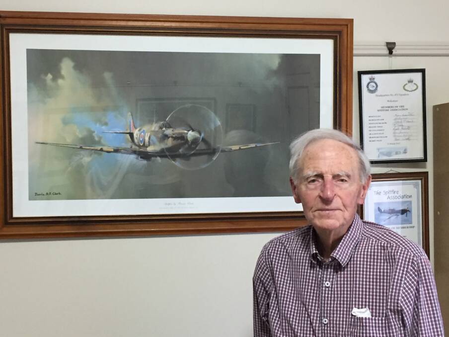 Sid Handsaker, with a picture of a Spitfire hanging in his residence. Picture: Scott Bevan