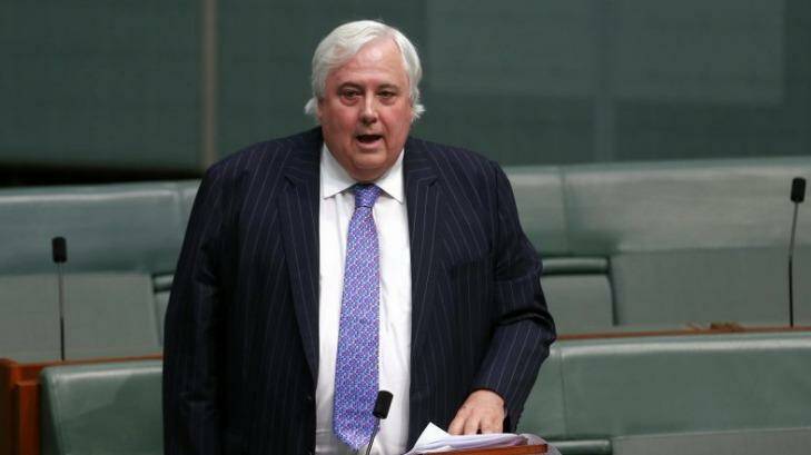 Under fire for treatment of senate staff ... Palmer United Party leader Clive Palmer speaks on the carbon tax in the House of Representatives. Photo: Alex Ellinghausen